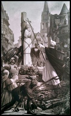 an old black and white photo of people working on a statue in the middle of a street