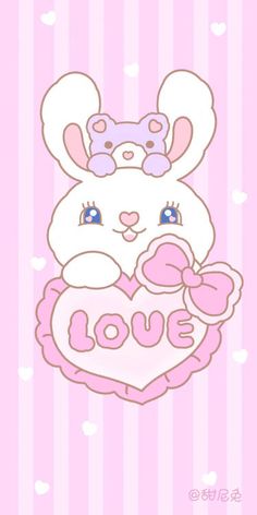 a cartoon bunny holding a pink heart with the word love on it's chest