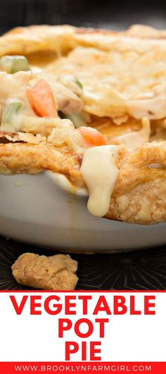 an egg and vegetable pot pie on a plate with crackers in the foreground