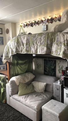 a loft bed with a couch underneath it