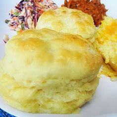 two biscuits on a white plate with flowers