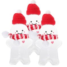 three snowmen with hats and scarfs are shown in the shape of an ornament