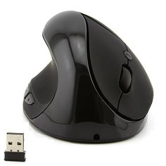 a black computer mouse sitting next to a small usb adapter on a white surface