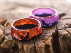 "Wedding wooden epoxy resin rings Fox & Wolf|Gift For Her For Him| Handmade Jewelry| Wooden Epoxy Rings|Unick resin wood Ring|Nature Eco Ring size: Inner diameter from 15mm to 24 mm The \"Fox & Wolf\" statement rings are made of black hornbeam and orange and purple jewelry resin. Both rings glow in the dark! Recommendations for care The ring is made of wood with jewelry resin on the top, treated with special natural oils in order to preserve the wood from external influences, however, you should Epoxy Rings, Epoxy Resin Rings, Wooden Epoxy, Resin Rings, Edgy Jewelry, Purple Jewelry, Jewelry Resin, Wood Ring, Orange Wedding