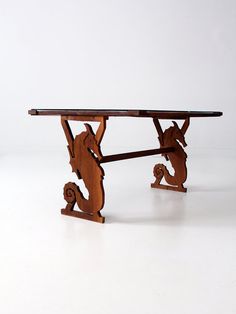 a wooden table with an animal design on it