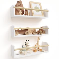 two white shelves with wooden toys on them and one is holding a baby's toy