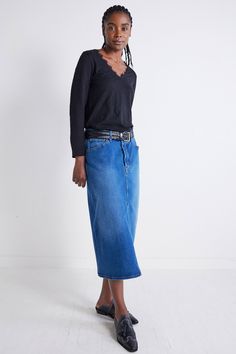 The 90's Denim Midi Skirt is a nostalgic revival of the iconic denim trends from the past, infused with a modern twist for a fresh and stylish edge. This skirt is crafted for those who appreciate the timeless charm of the '90s, making it a must-have piece for the fashion-forward individual. Midi length Split center hem Denim fabric Pockets Lace Trim Long Sleeve, 90s Denim, Denim Trends, Denim Midi Skirt, Fashion Help, Denim Fabric, Lace Detail, Midi Length, Wardrobe Staples