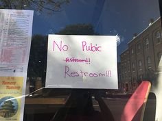 a sign posted on the window of a restaurant that says no public restroom rest room