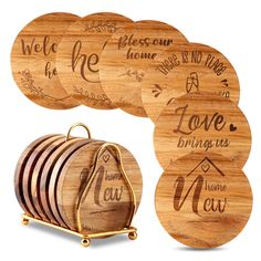 wooden coasters with engraved names on them and a gold holder for the coasters