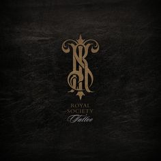 the royal society logo on a black leather cover with gold lettering and an ornate monogram