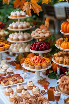 a table topped with lots of different types of desserts