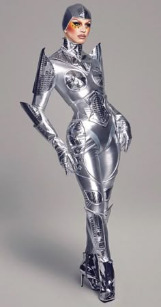 a woman dressed in silver posing for the camera