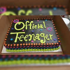 there is a cake in the box that says official teenager on it and decorated with sprinkles