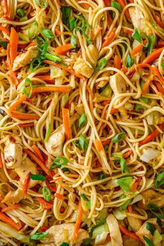 the noodles are mixed with chicken and vegetables