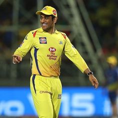 a man in yellow uniform running on a field