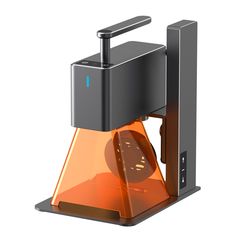 an orange clock sitting on top of a metal stand with a black cover over it