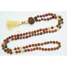 Chakra yOGA eNERGY bEADS Veda Mala Beads Balance Root Chakra Red Coral Pearl Yellow JADE Wards Off Negative Energies Mala Lenth Approx : 14". The mala consist of 6mm to 8mm beads. 80+1 Rudraksha and 28 round stone beads There are 7 main energy centers in the body, known as chakras. Each chakra is located throughout our body so that it correlates to specific body ailment and physical dysfunctions; each energy center also houses our mental and emotional strengths. When we have a physical issue, it Multicolor Beaded Mala For Meditation, Balance Root Chakra, Yoga Energy, Energy Yoga, Energy Centers, Beads Mala, Emotional Strength, Chakra Yoga, 8mm Beads