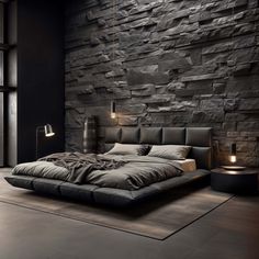 a large bed sitting in front of a stone wall