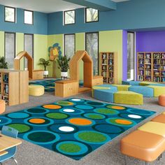 the children's playroom is brightly decorated with blue, yellow and green colors