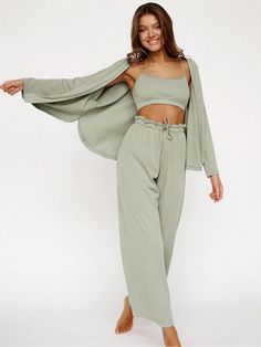 Indulge in luxurious comfort with our Knitted Cardigan Camisole Pajama Set. This chic ensemble features a cozy knitted cardigan, complemented by a stylish camisole and matching long pants. Perfect for chilly nights or lounging in style, this set adds a touch of romance to your sleepwear collection. Ideal for those seeking sexy and romantic pajamas for a cozy evening in. Casual Lounge Wear, Lounge Wear Set, Bandeau Tops, Gilet Long, Estilo Chic, Sleeves Clothing, Cardigan Long, Cardigan Vest, Loungewear Set