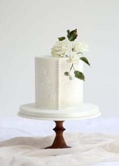 there is a white cake with flowers on it