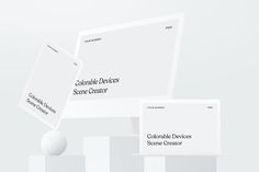 three white business cards on top of each other