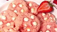 some cookies with white chocolate chips and a strawberry