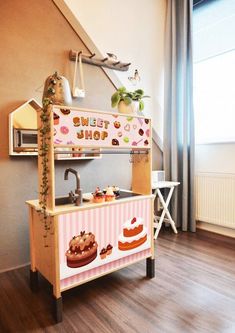 an ice cream shop is decorated with donuts and cupcakes on the counter