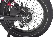 the front wheel of a motorcycle with brake pads and disc brakes on it's rear tire