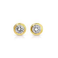 These simple and classic 14kt gold and moissanite bezel studs are so comfortable, you'll never take them off. You can live in these and never worry about having to take them off. They have flat screw backs, so I like to call them the nap earrings because you can sleep comfortably in them.  They will quickly become a staple in your rotation. They come in two sizes and they are perfect if you have a lot of piercings, or just prefer to keep it simple and classy.   Large stud is in model's first pie A Lot Of Piercings, Nap Earrings, Second Piercing, April Birthstone Jewelry, March Birthstone Jewelry, Forever Jewelry, Pearl Jewellery Earrings, Men's Jewelry Rings, Evil Eye Jewelry