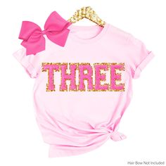 3rd Birthday Shirt Girl, 3rd birthday Outfit Three tshirt, Third Birthday Sweatshirt, 2nd Birthday Girl Shirt Chenille patches MORE BIRTHDAY SHIRTS HERE: https://etsy.me/3K1zlAK Shop with Confidence! We are a 5-Star Rated Shop operating since 2015! SIZING: * All sweatshirts are unisex, classic fit. Please refer to size chart in listing photos for details. * Easy measuring tip: Take your favorite shirt, lay it on a flat surface and measure the width (armpit to armpit) and length (top to bottom) * Pre-shrunk Pink Shirt For Birthday, Pink Letter Print Top For Birthday, Pink T-shirt For Birthday, Pink Crew Neck Top For Birthday, Pink Birthday T-shirt With Name Print, Pink Letter Print Shirt For Birthday, Pink T-shirt With Name Print For Birthday, Pink Short Sleeve T-shirt With Number Print, Number Print Short Sleeve Top For First Birthday