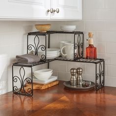 a kitchen counter with dishes and cups on it