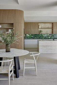 a white table and chairs in a room