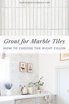 a white kitchen with marble tiles on the wall