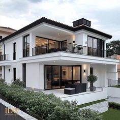 a large white house with black balconies