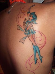 a woman with a tattoo on her back