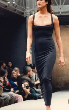 The perfect black dress from Alaïa's Spring Summer 1988 collection . Azzedine Alaïa gained his reputation by creating sleek dresses that hug the body, this dress is the ideal example of his iconic style. So chic. This stretch ankle-length dress has the most incredible fit - it hugs the body and it is so comfortable to wear. It is made from a stretch knit and features a low square neckline, beautiful open-work along the seamlines which gives the dress its feminine shape. The skirt is slightly ruc Vintage Alaia Dress, Chic Office Wear, Alaia Dress, Azzedine Alaïa, Rare Dress, Cord Dress, Knit Skater Dress, Vintage Runway, Leather Pleated Skirt