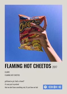 a hand holding a bag of cheetos in front of a blue sky with hearts