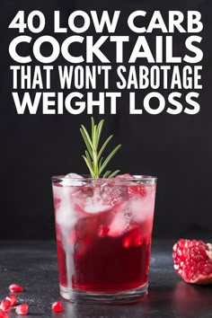 a glass filled with red liquid and garnish next to pomegranate