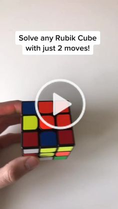 someone holding a rubik cube with just 2 moves in front of the camera text reads solve any rubik cube with just 2 moves