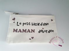 a white pouch with words and hearts on it