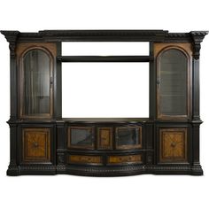 an old fashioned entertainment center with glass doors and wood trimmings on the sides