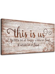 a wooden sign that says, this is us and the words are written on it