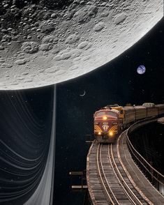 a train traveling across a bridge next to the moon