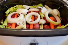 the food is being cooked in the slow cooker