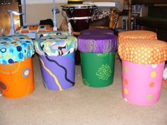 there are many colorful stools on the floor