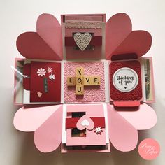 the inside of a card box with cards and magnets in it that say i love you