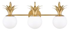 three light brass bathroom fixture with white glass balls and pineapples on the top