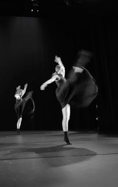 two dancers in black and white performing on stage