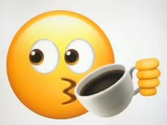 an emoticive smiley face holding a cup of coffee with its tongue sticking out